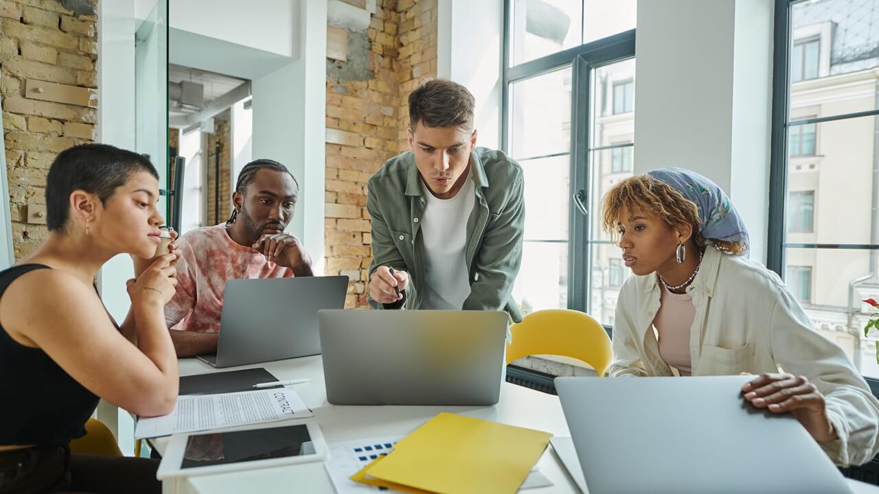 A team building a system around laptops